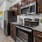 a kitchen with black appliances