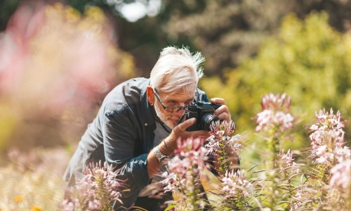 a man taking pictures of nature