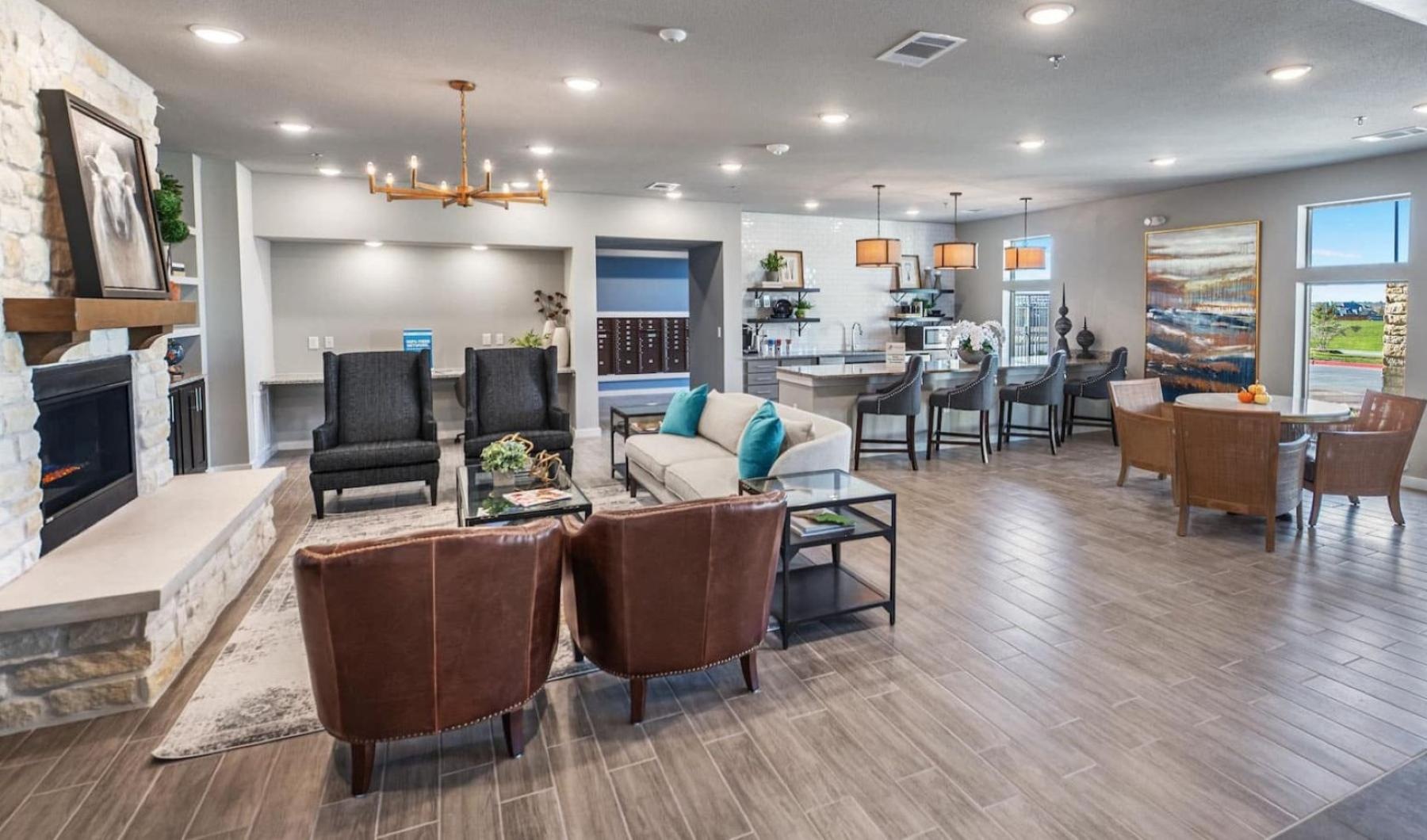 Settle into comfort at The Preserve at Gateway clubhouse with fireplace and kitchen