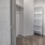 bright, walk-in closet with shelving