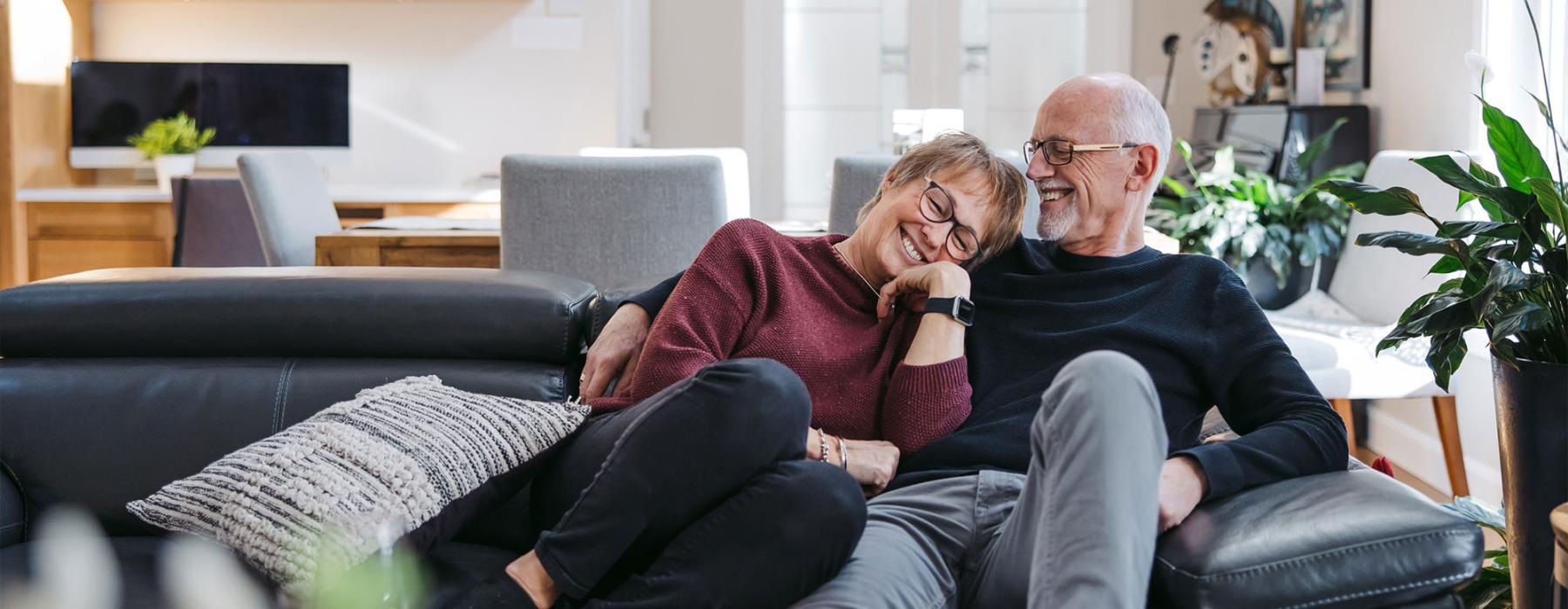 a man and woman sitting on a couch