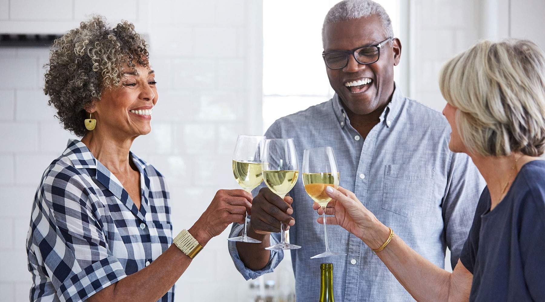 Welcome Home older people toasting with wine