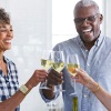 older people toasting with wine
