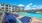 lounge chairs next to pool